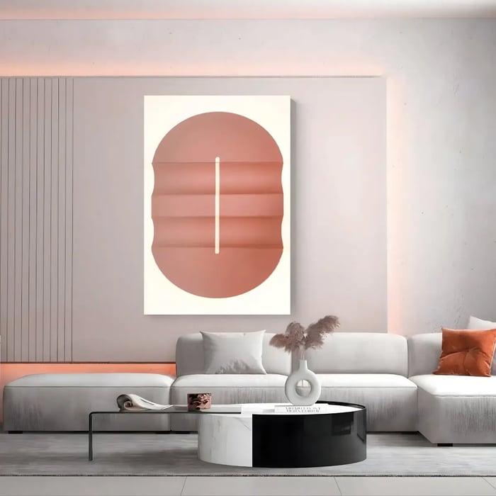  A modern, light-filled living room with a soft coral-toned abstract wall piece, featuring layered textures against a neutral background, complementing the contemporary furnishings.