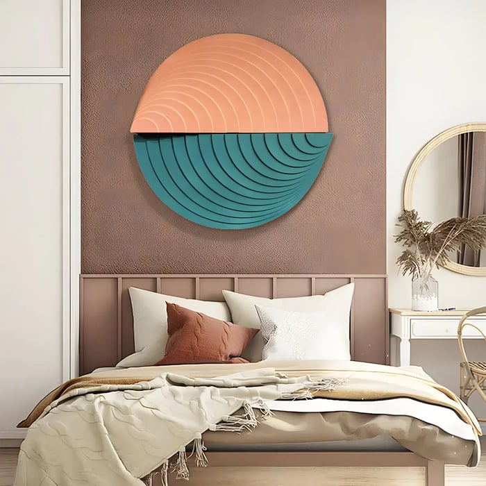 A cozy bedroom featuring a large circular artwork with layered textures in terracotta and teal, complementing the earthy-toned decor and soft bedding.