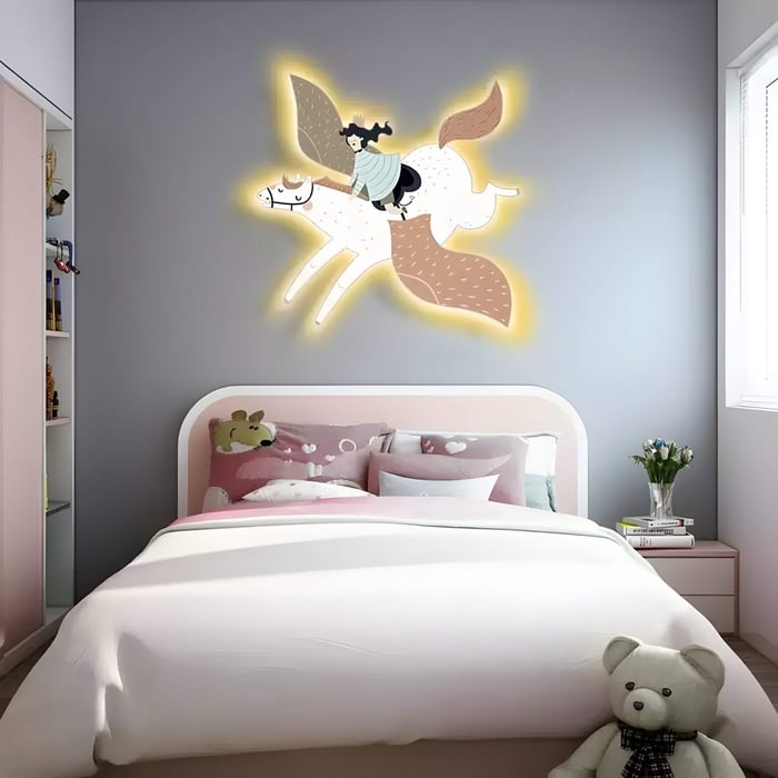 Cozy kids’ bedroom with glowing wall art of a flying horse and rider above a pink and white bed.
