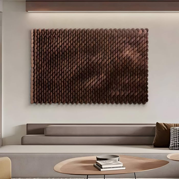  Warm-toned modern art made of overlapping oval wooden tiles creating a gradient on a neutral wall.
