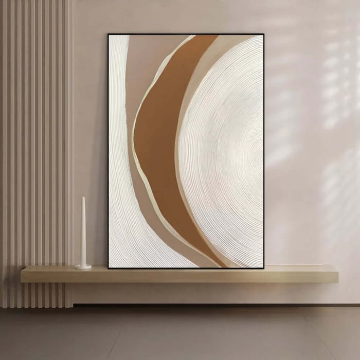 Neutral abstract wall art with curved brown and cream shapes and fine textured lines in a minimalist interior.
