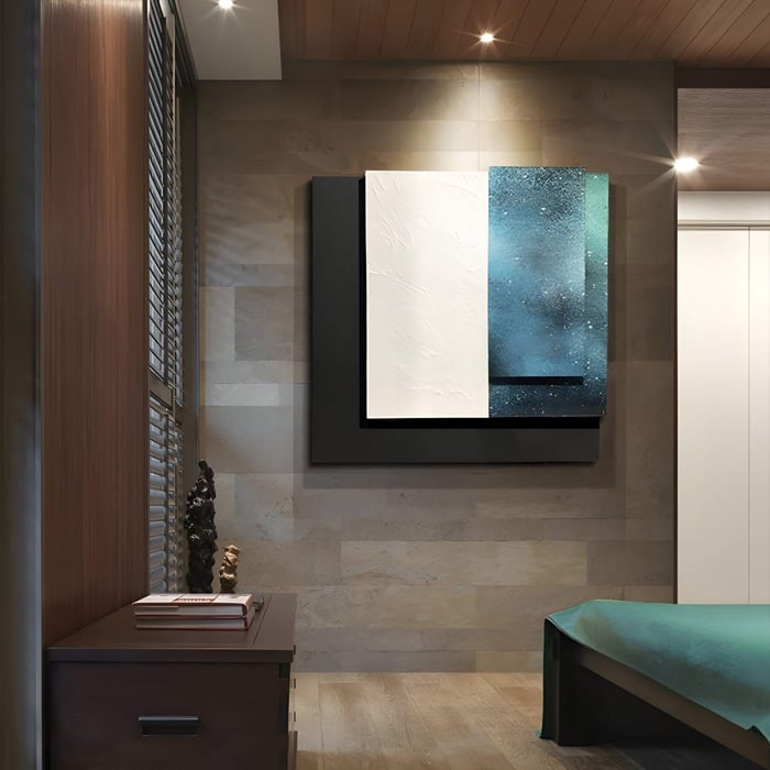 Modern textured canvas in deep blue & white displayed in a softly lit bedroom with natural wood finishes and teal bedding.