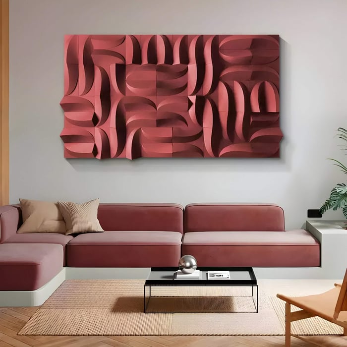 Living room with bold red 3D wall art composed of sculpted curves, paired with a muted red sectional and modern decor.