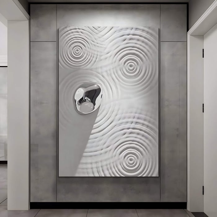 Zen-inspired ripple panel with silver accent mounted in a narrow hallway, capturing calm motion in contemporary relief.