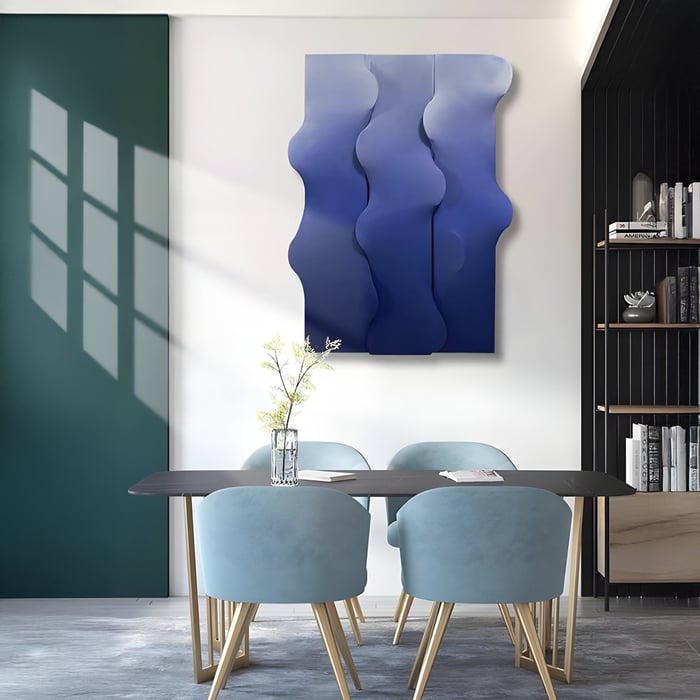 Gradient blue sculptural wall art with flowing curves adds elegance to a modern dining room setup.