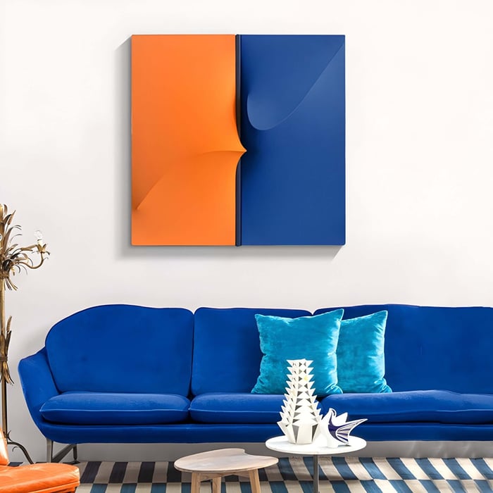 Bold contemporary living room with a vibrant blue and orange abstract wall sculpture.