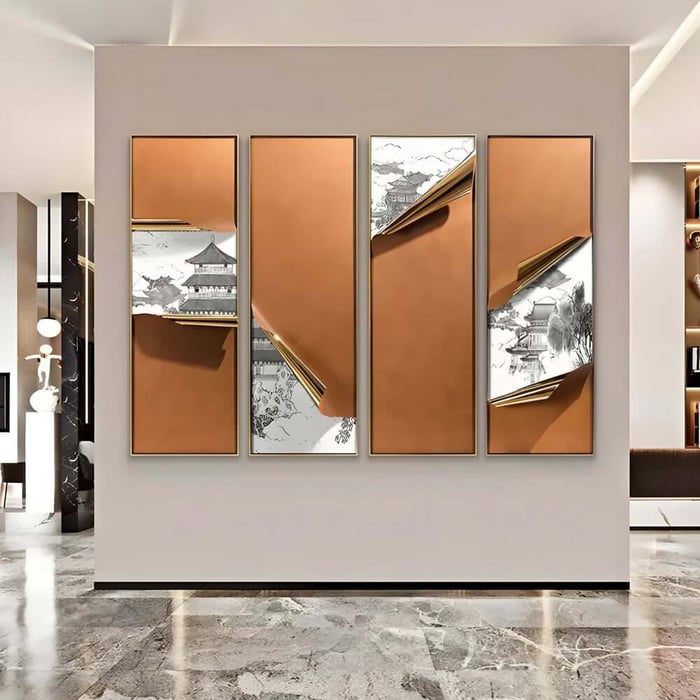 Bright modern interior with a four-panel architectural wall art set in warm copper tones and black-and-white landscape details on a feature wall