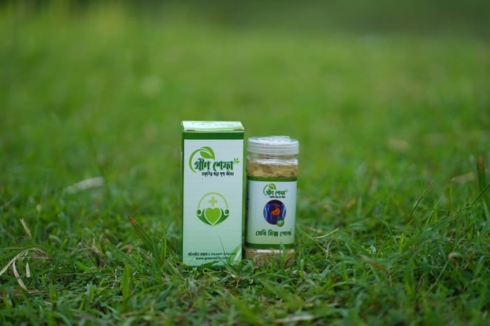 Herbal medicine bottle and box on grass