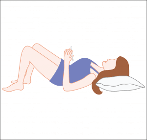 Lay on your back and part your legs slightly. That way you'll use gravity to insert the suppository deep enough into the vagina.
