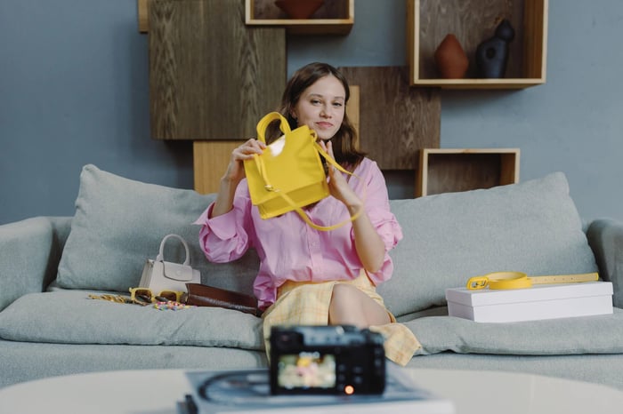 Influencer marketing for small business: creator filming a fashion haul video