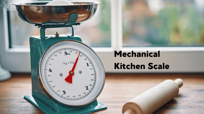 mechanical kitchen scale and rolling pin