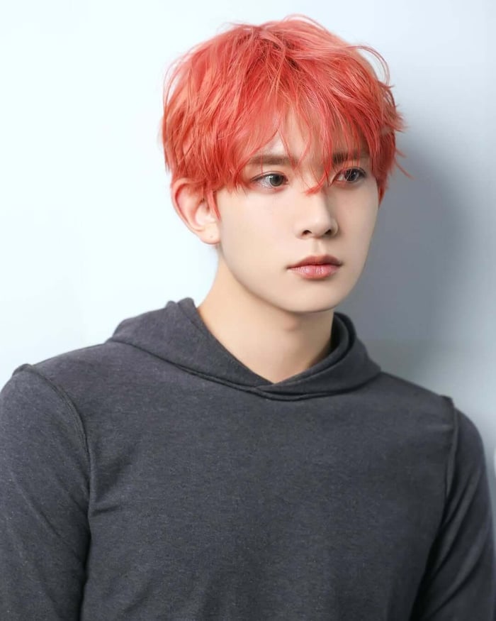 Heeseung from ENHYPEN is a hair trendsetter, rocking colors from brown to silver, proving individuality shines through any look.