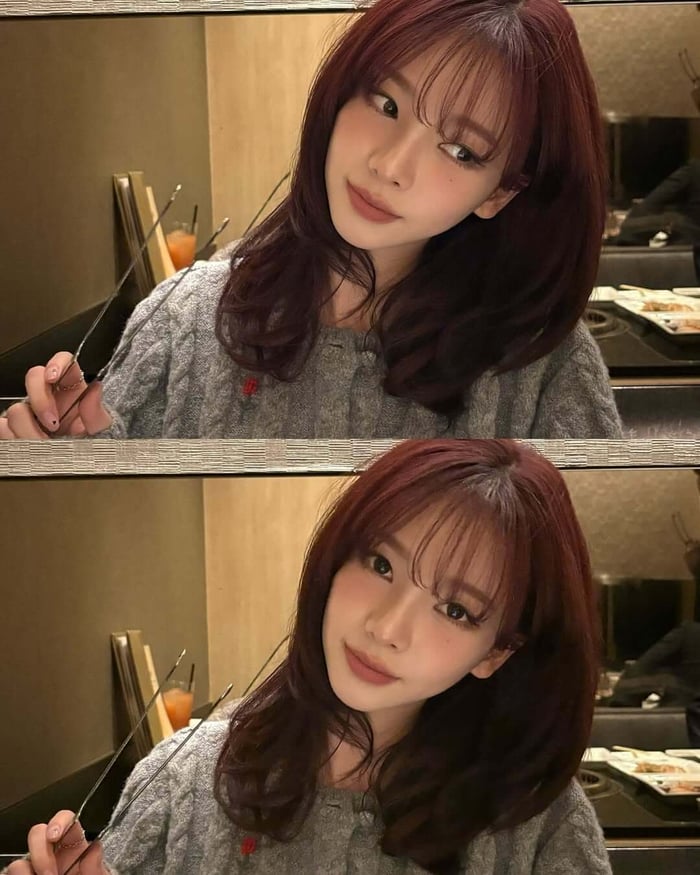 aespa's Karina has sparked a major hair trend with her stunning Wine Red hair, captivating fans and inspiring a wave of imitations with its rich hue and flattering effect on her porcelain skin.