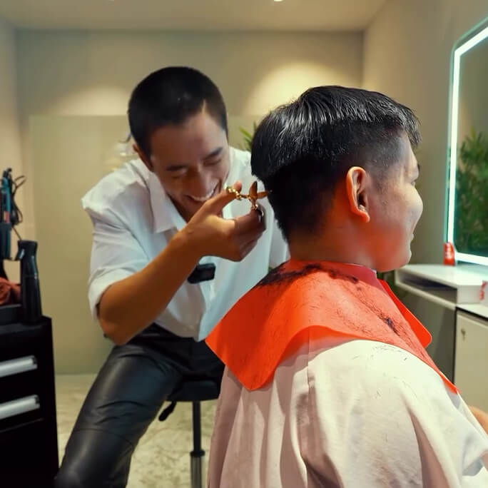 Getting nervous with his first haircut