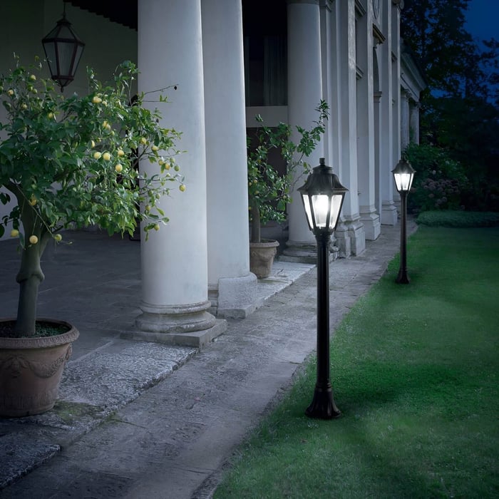 https://niori.co.uk/products/gaze-1-light-lamp-post-blackElegant garden scene with vintage lamp posts lighting a columned terrace and lemon trees.
