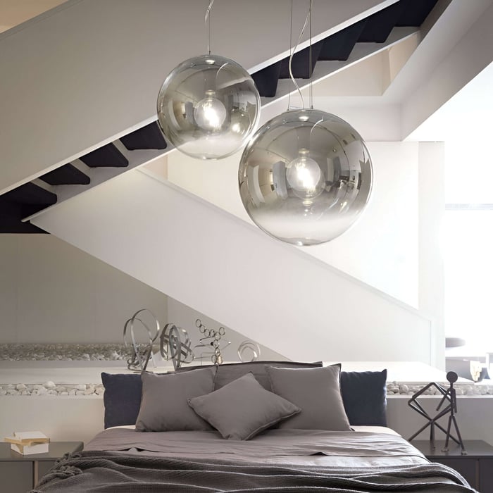 Large reflective glass globe pendant lights, ideal for modern living spaces with a contemporary aesthetic.