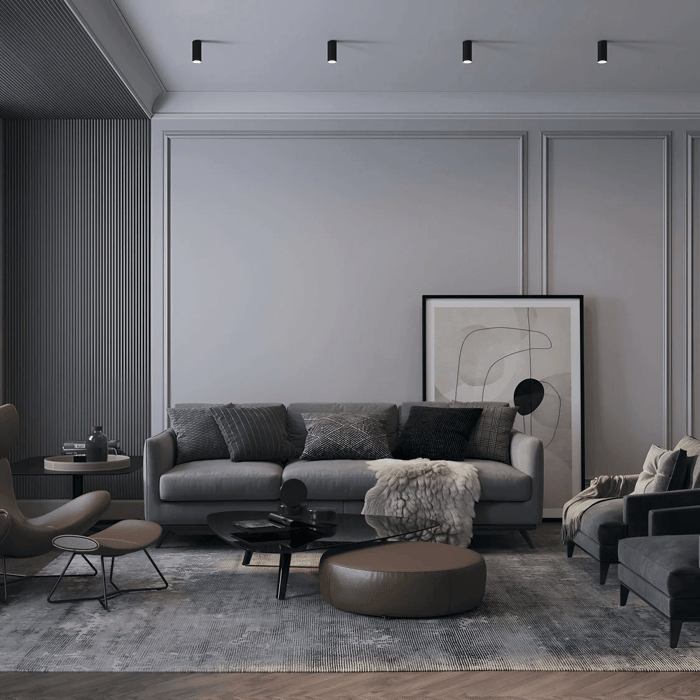  A dining room with recessed lights above a round dining table, designed with soft, earthy tones and minimalist decor, creating a welcoming and warm environment.