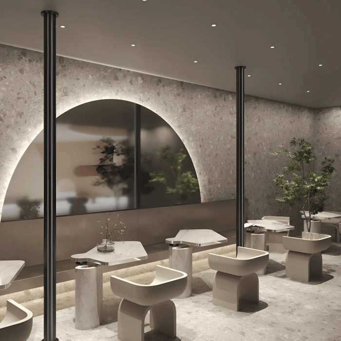 A living room with recessed track lighting on the ceiling, creating a clean and minimalist atmosphere with modern furniture and neutral-toned walls.