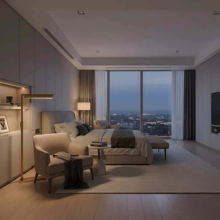 Modern bedroom suite with floor lamp, upholstered armchair and panoramic night city view through large windows.