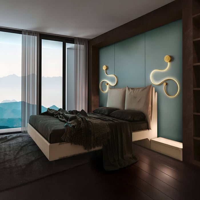 Curved LED wall sconces glowing symmetrically behind a bed with teal accent wall.