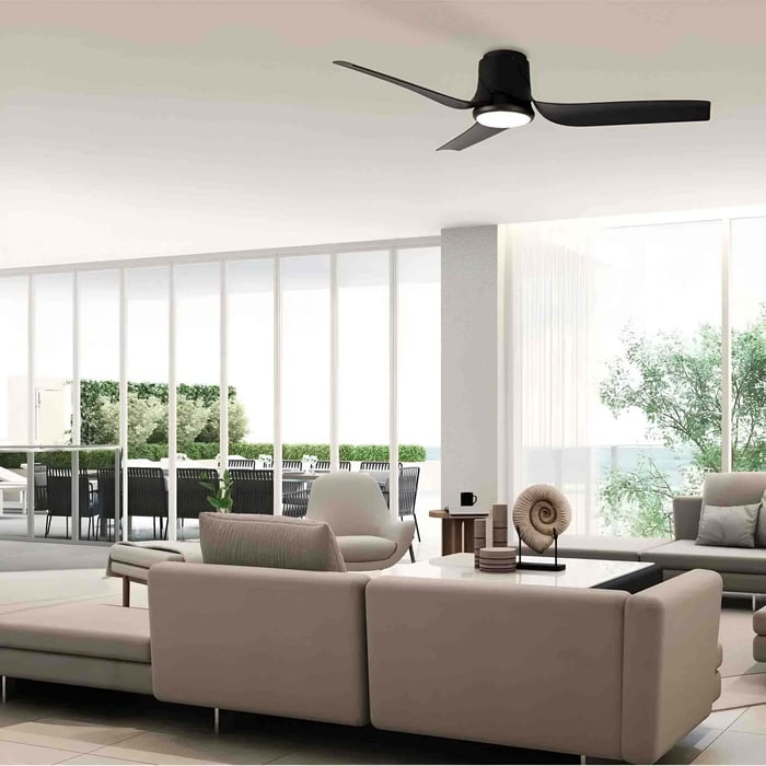 Black three blade ceiling fan light in a contemporary open plan living room.