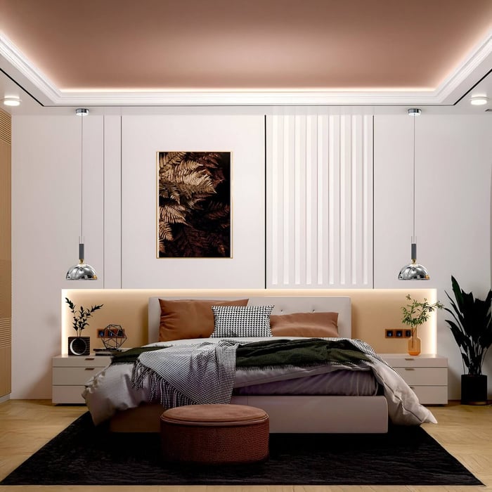 Contemporary bedroom featuring twin hanging pendant lights over nightstands, with layered bedding and warm accent lighting.