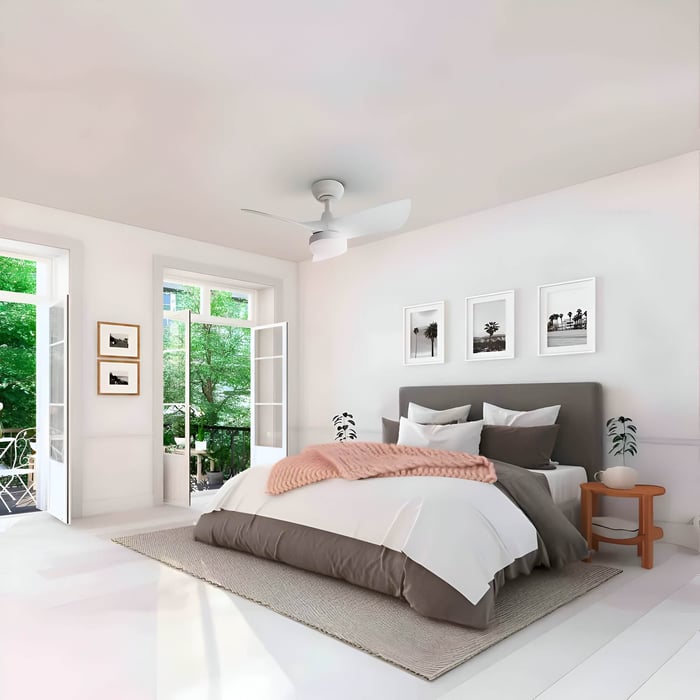 Minimal white ceiling fan light centered over a bright neutral bedroom.