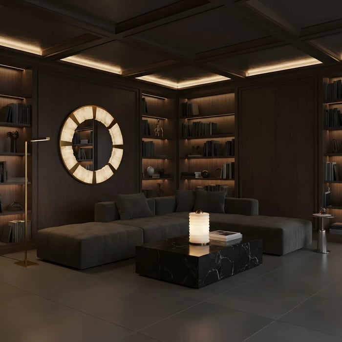 Modern living room with illuminated alabaster mirrors on wood panel wall and warm ambient lighting.