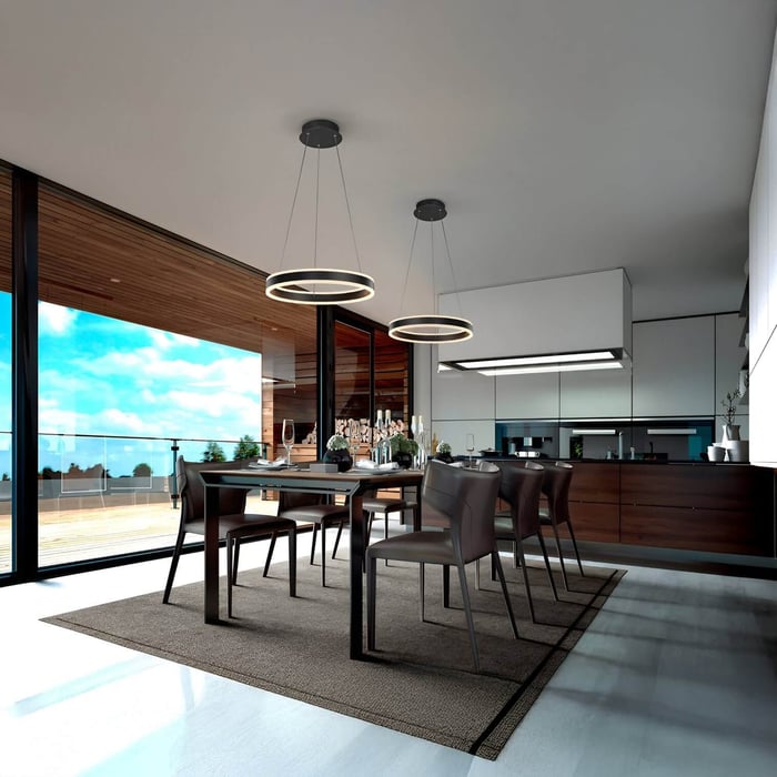 Open dining area with panoramic windows, black chairs, and twin ring-shaped pendant fixtures as sleek dining room lights.