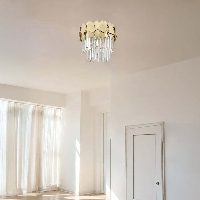 Minimalist white tube pendant ceiling lights over a sleek gray kitchen island.