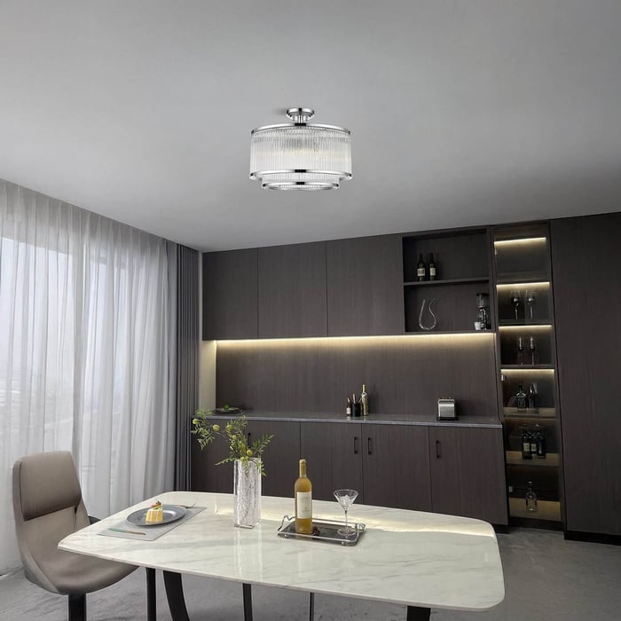 Compact crystal drum ceiling light in a sleek modern dining room with marble table.