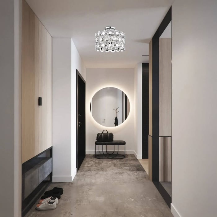 Contemporary hallway with a round backlit mirror, bench seating, shoe storage, and a crystal flush mount ceiling light.