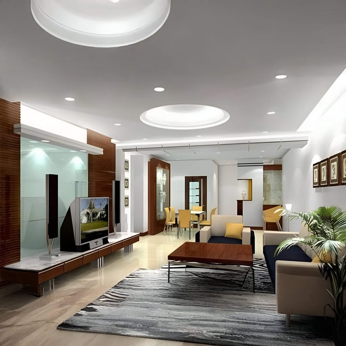 Contemporary living room with recessed ceiling lighting and a large circular feature ceiling light.
