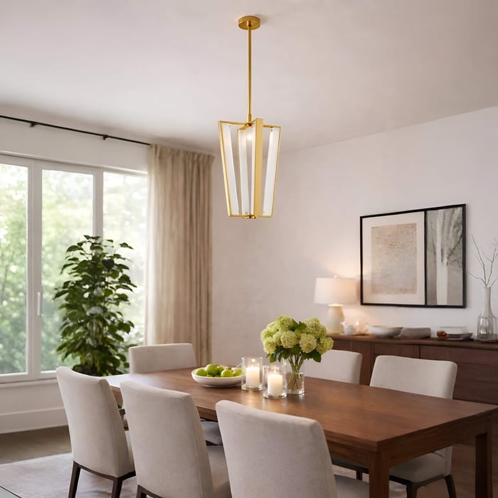 Elegant dining space with gold lantern-style pendant light above wooden dining table.