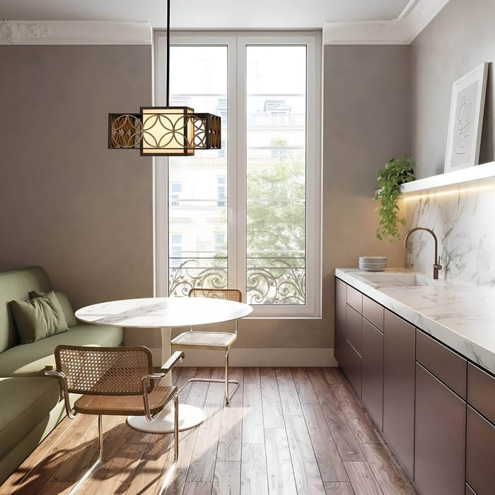 Elegant small dining space with a marble-top table, modern chairs, and a geometric gold and black chandelier light above.