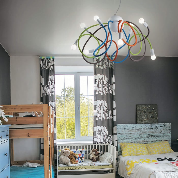Playful chandelier with colorful looping cables and exposed bulbs, perfect for a children's room.