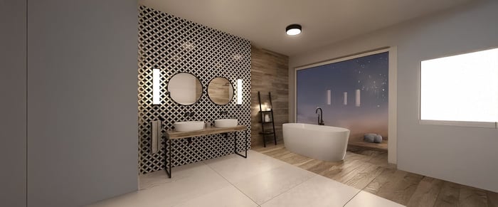 Spacious bathroom with freestanding tub, double sinks, and black-and-white accent wall with modern bathroom lights.
