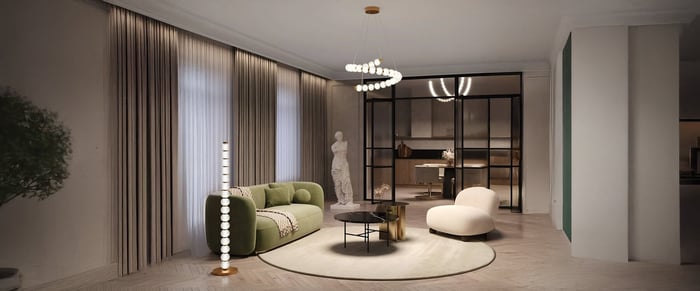 A modern living room featuring a spiral chandelier hanging from the ceiling, a green curved sofa, a glass coffee table, and a decorative floor lamp with multiple living room lights orbs, all set against large windows with sheer drapes.