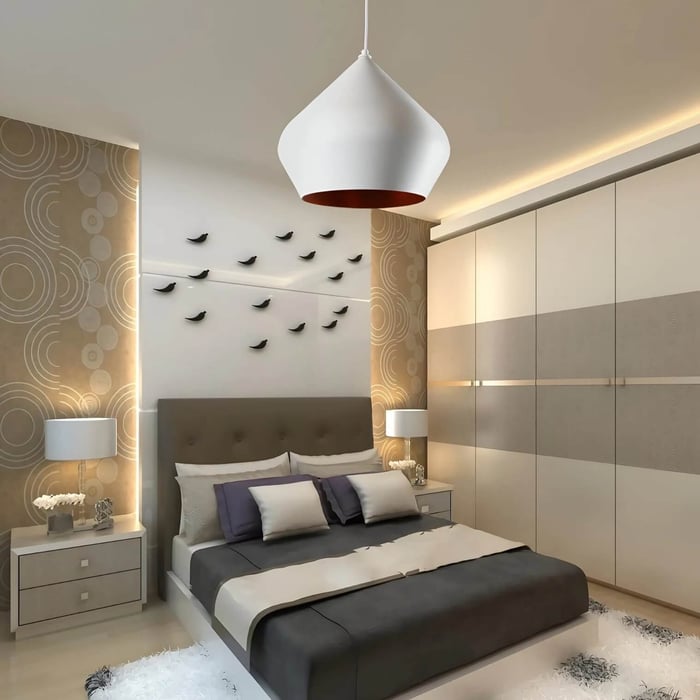 Bright bedroom with white statement pendant light and bedside table lamps.