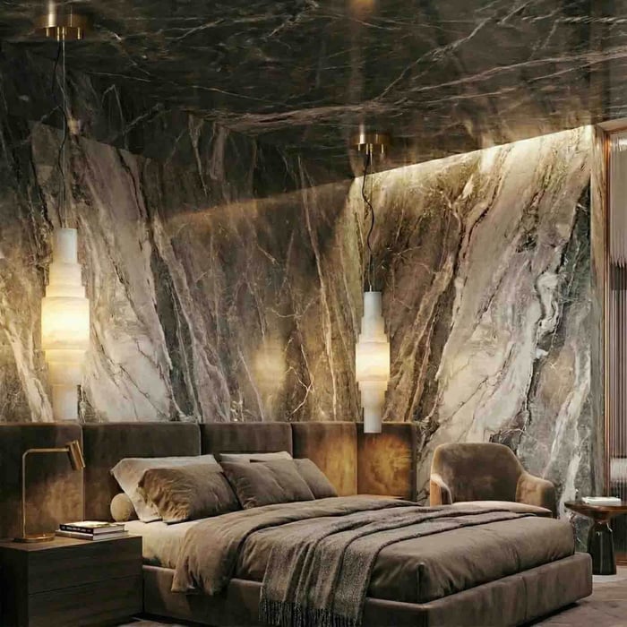 Luxury bedroom with marble feature wall and two warm pendant lights above the bed.
