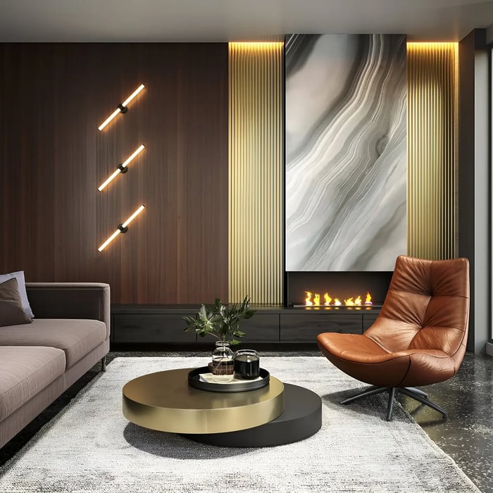Contemporary living room featuring a stylish accent wall with vertical light strips and a textured fireplace panel. The space includes a brown leather recliner chair, a round coffee table, and ambient lighting accents.