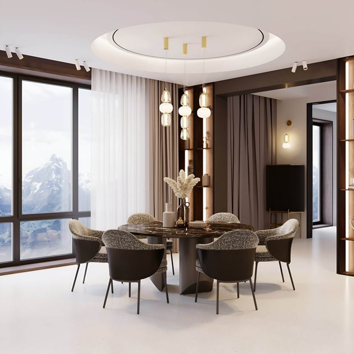 Elegant dining room with round table, upholstered chairs, modern pendant lights, and large windows showcasing a mountain view.
