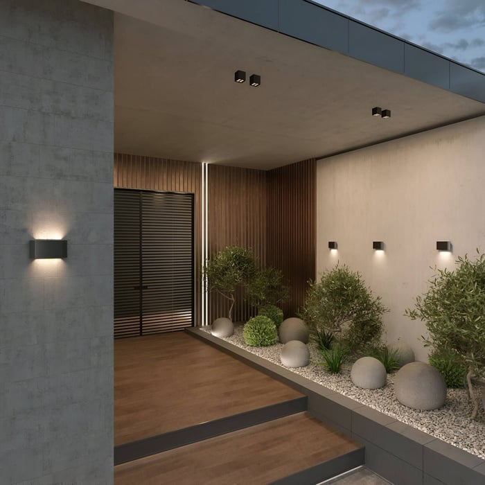 Minimalist black rectangular wall lights illuminating a modern entryway with wood panels and potted plants.