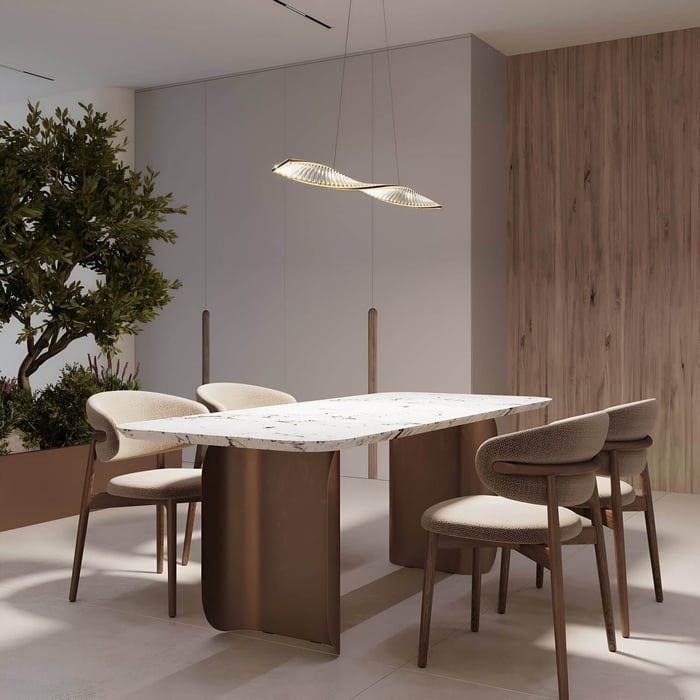 Curved LED pendant light over a marble-top dining table with four modern taupe upholstered chairs.
