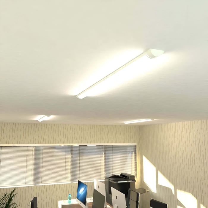 Batten Lights in an office ceiling providing neutral white task lighting.