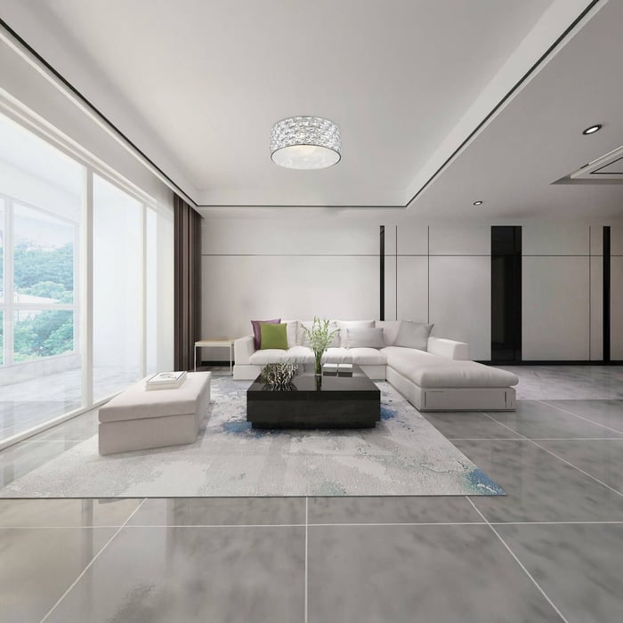 Spacious white living room with sectional sofa and crystal flush mount ceiling light.