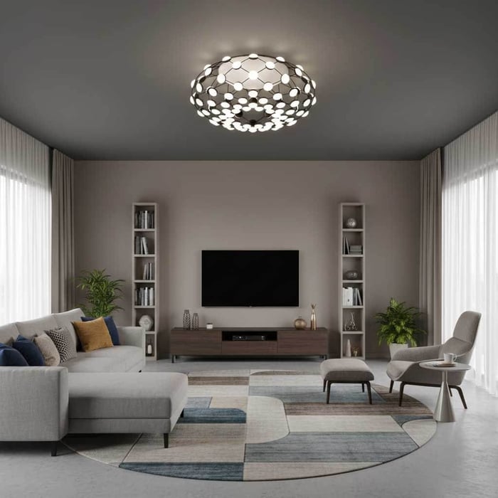 Contemporary living room with a geometric flush-mount ceiling light, gray sectional seating, large windows, and a patterned area rug.