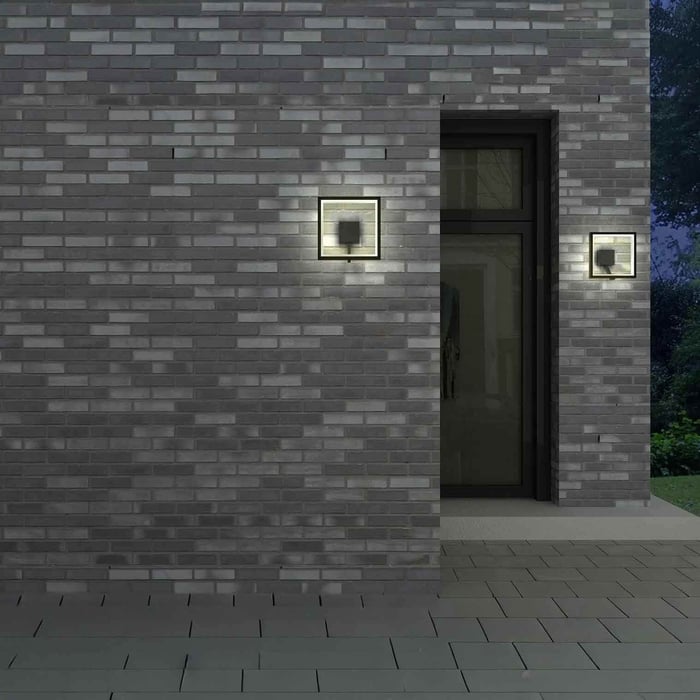 Modern wood-slat exterior wall with a row of compact outdoor downlights creating even nighttime illumination.