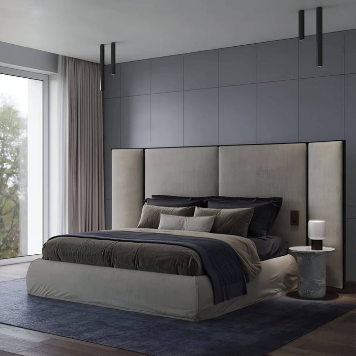 Minimalist bedroom with black tube ceiling spotlights and tall upholstered headboard.