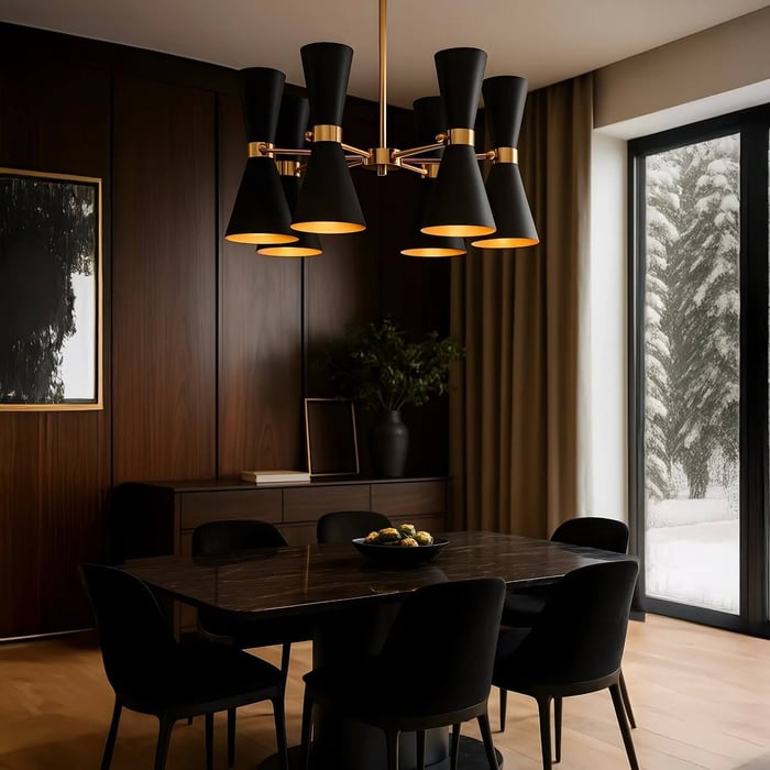 Black and gold multi-shade chandelier casting warm light over a dark wood dining table.